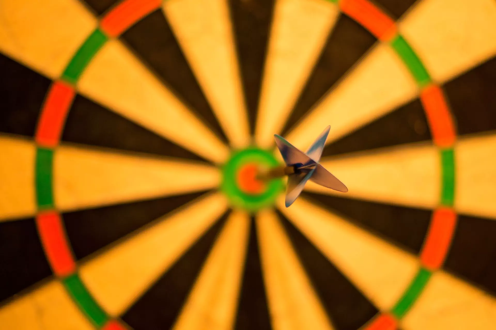 A dart in the centre of a dart board