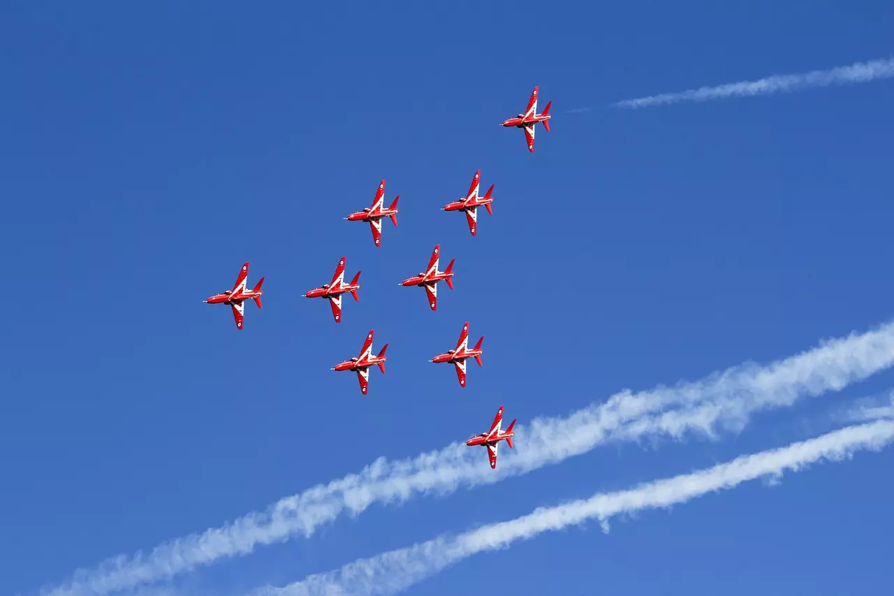 Nine of the RAF Red Arrows flying their BAE Hawk T1s in formation