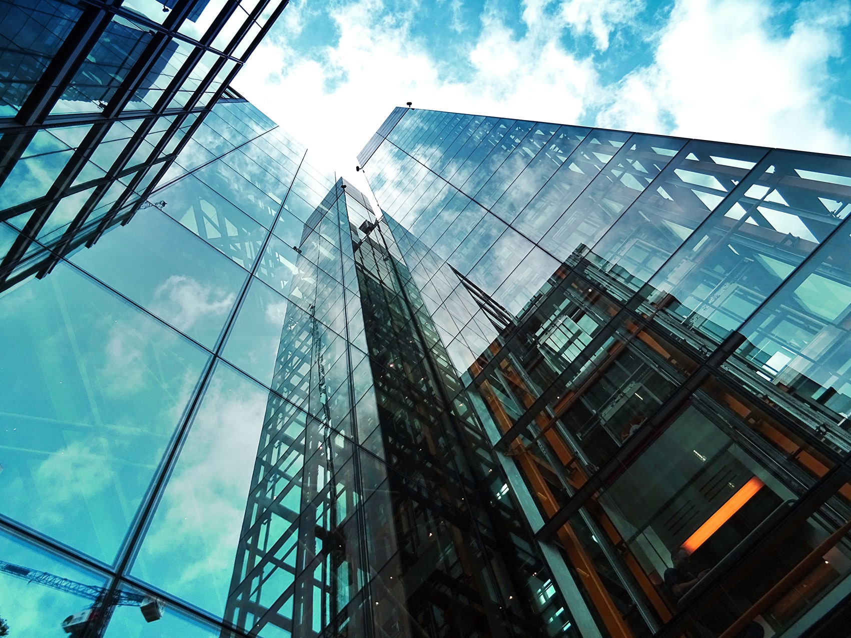 Glass-fronted skyscrapers viewed from below